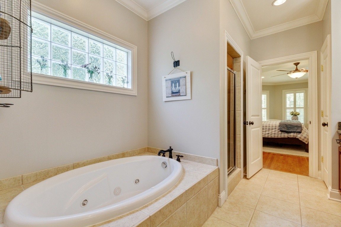 5660 Pinewood Road Franklin, TN 37064 - Photo 20 of 45 a bathroom with bathtub and a view of living room