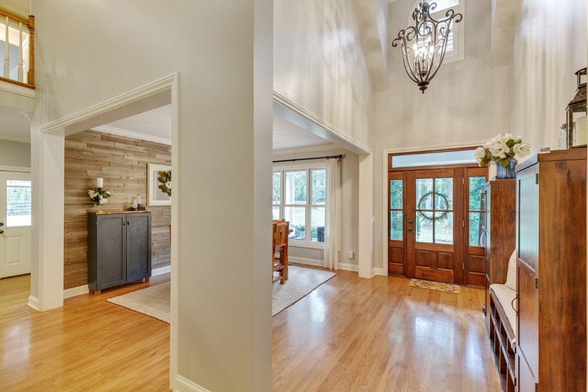 5660 Pinewood Road Franklin, TN 37064 - Photo 3 of 45 a view of empty room with wooden floor and fan
