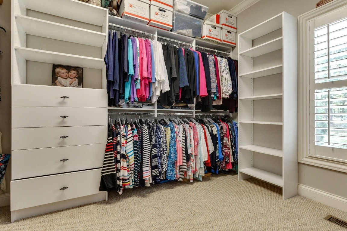5660 Pinewood Road Franklin, TN 37064 - Photo 21 of 45 a view of walk in closet with clothes and shoes