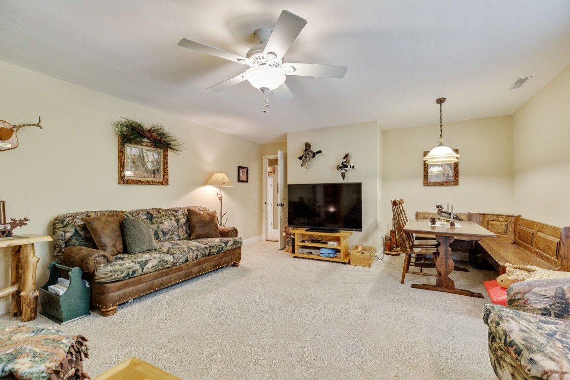 5660 Pinewood Road Franklin, TN 37064 - Photo 24 of 45 a living room with furniture and a flat screen tv