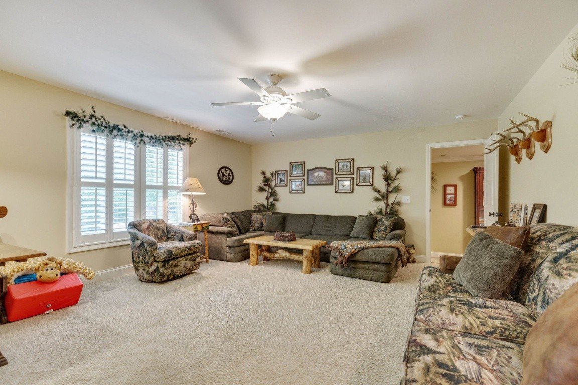 5660 Pinewood Road Franklin, TN 37064 - Photo 25 of 45 a living room with furniture chandelier and a large window