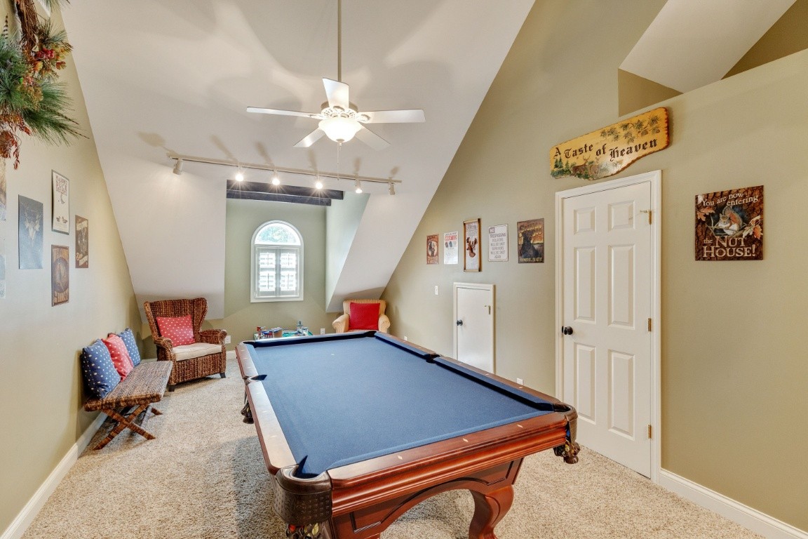 5660 Pinewood Road Franklin, TN 37064 - Photo 28 of 45 a room with chandelier fan and windows