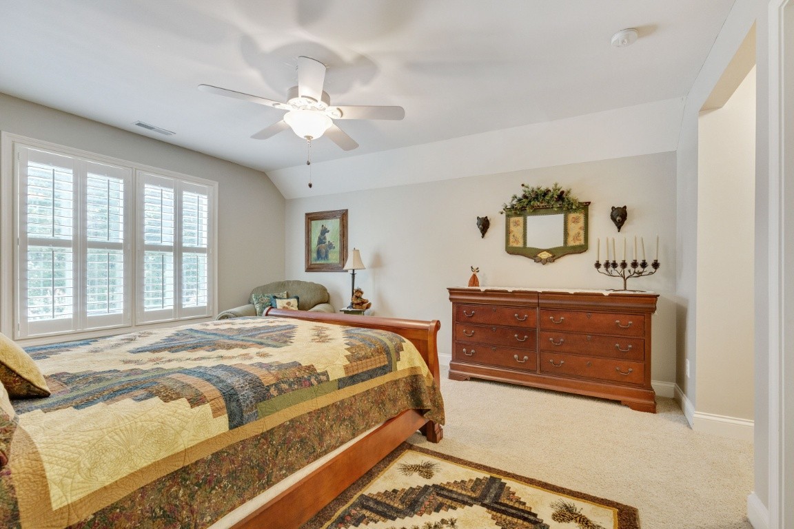5660 Pinewood Road Franklin, TN 37064 - Photo 33 of 45 a bedroom with a bed and a dresser