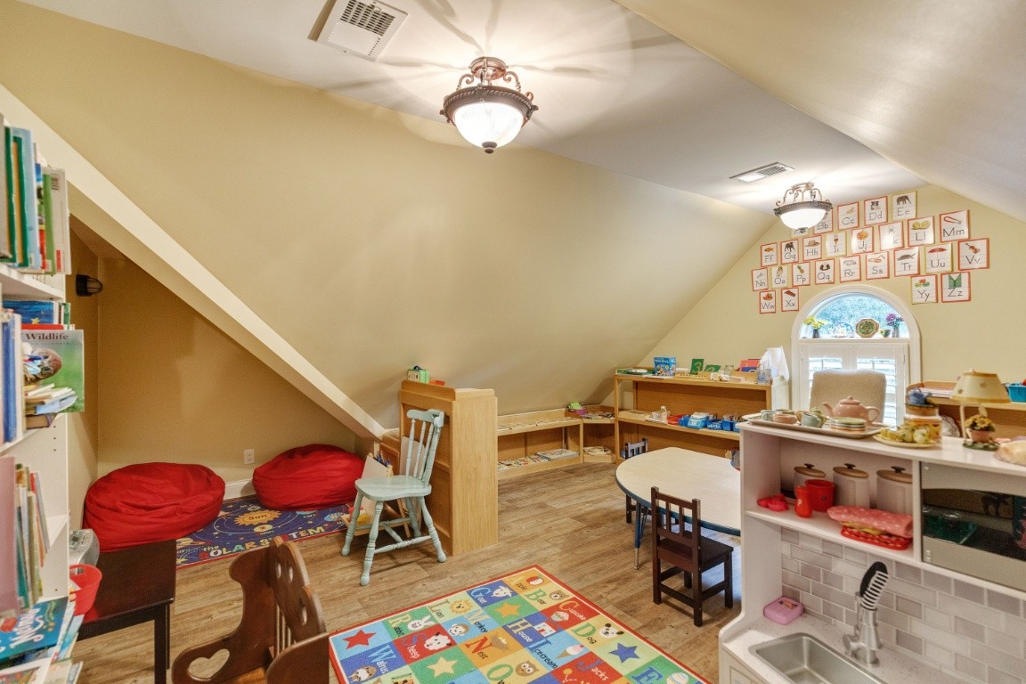 5660 Pinewood Road Franklin, TN 37064 - Photo 35 of 45 a living room with furniture a chandelier and a rug