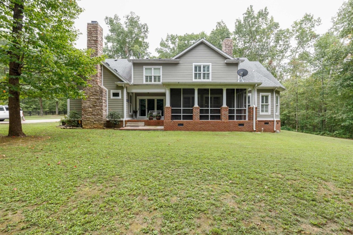 5660 Pinewood Road Franklin, TN 37064 - Photo 38 of 45 a front view of a house with a yard and green space