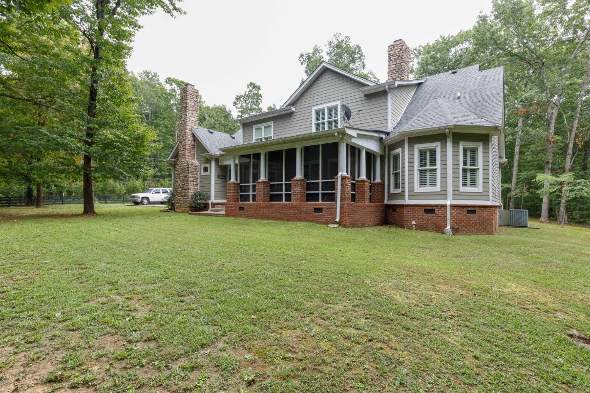 5660 Pinewood Road Franklin, TN 37064 - Photo 39 of 45 a front view of a house with a garden and trees