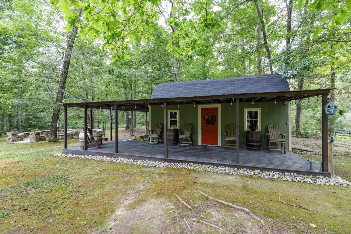 5660 Pinewood Road Franklin, TN 37064 - Photo 41 of 45 a view of a house with a swimming pool and sitting area
