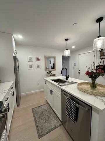 a spacious bathroom with a sink double vanity and a mirror