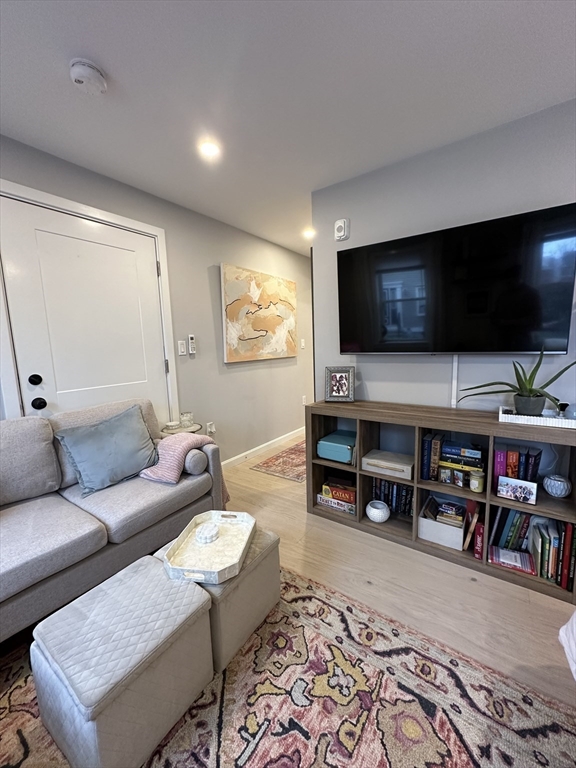24 Ferrin Street, Unit 2 Boston, MA 02129 - Photo 7 of 9 a living room with furniture and a flat screen tv