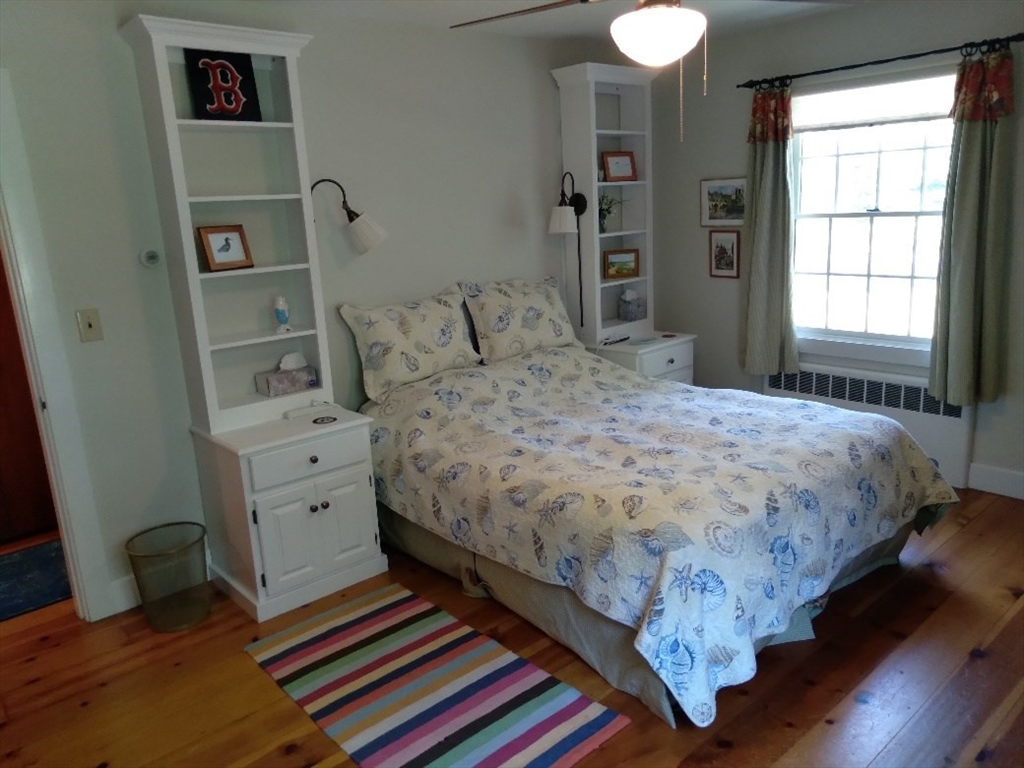 43 Poponessett Road Barnstable, MA 02635 - Photo 24 of 29 a bedroom with a bed and a window