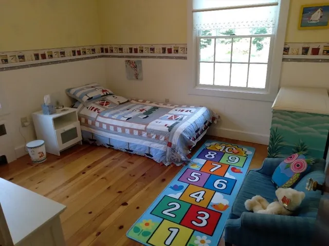 a room with furniture and a wooden floor