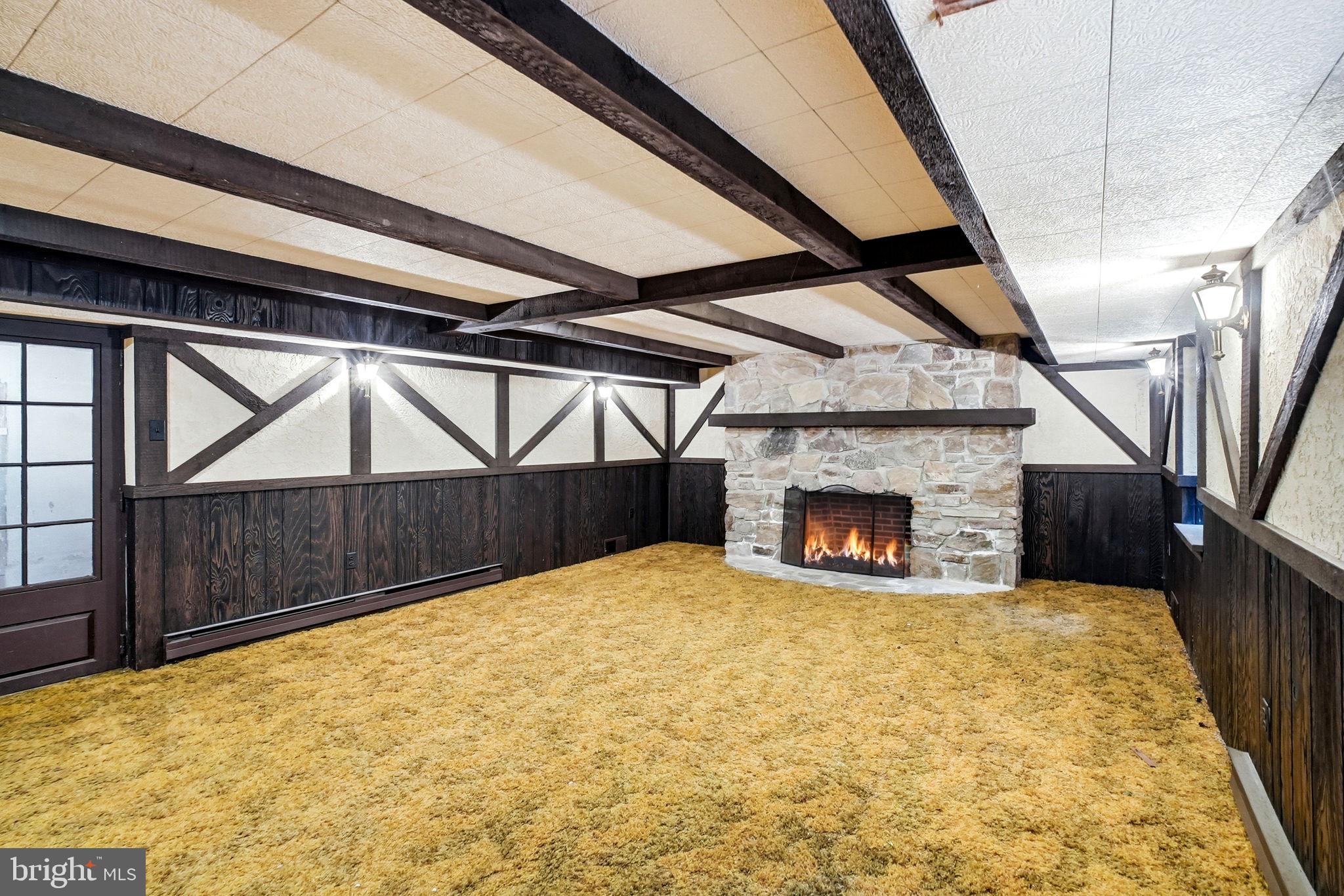419 Riverview Road Swarthmore, PA 19081 - Photo 49 of 70 a view of an empty room with a fireplace and a window
