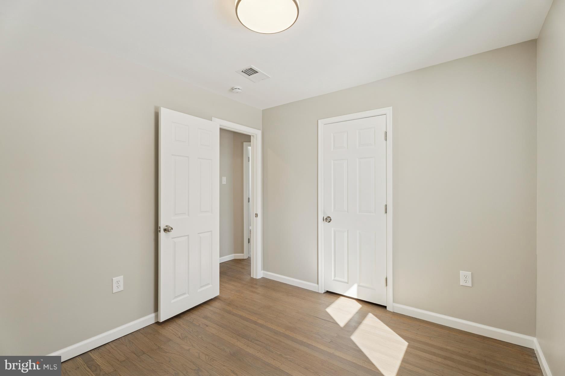 306 Grape Street Warminster, PA 18974 - Photo 13 of 25 a view of an empty room with wooden floor