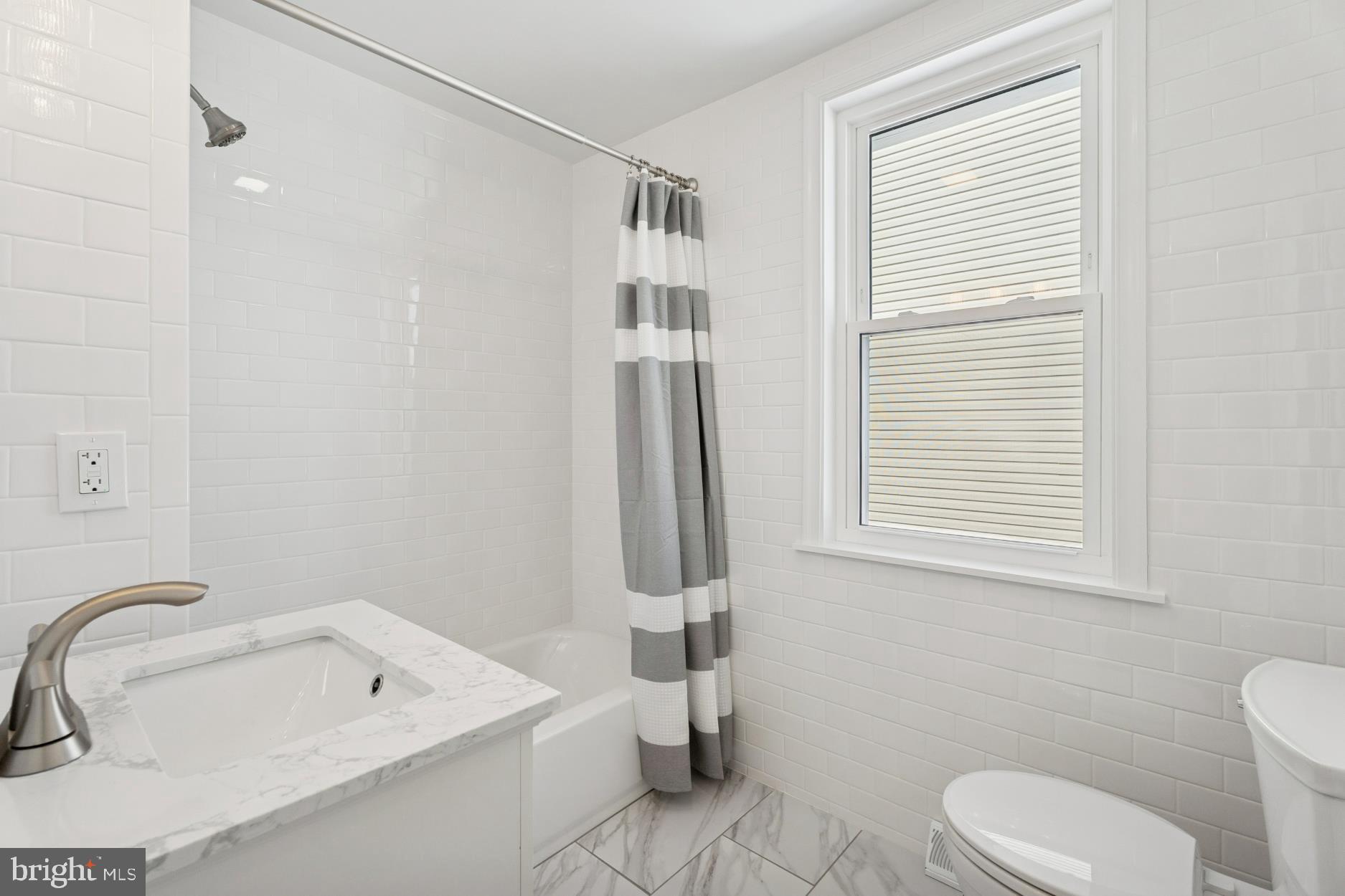 306 Grape Street Warminster, PA 18974 - Photo 17 of 25 a bathroom with a sink a toilet and a tub