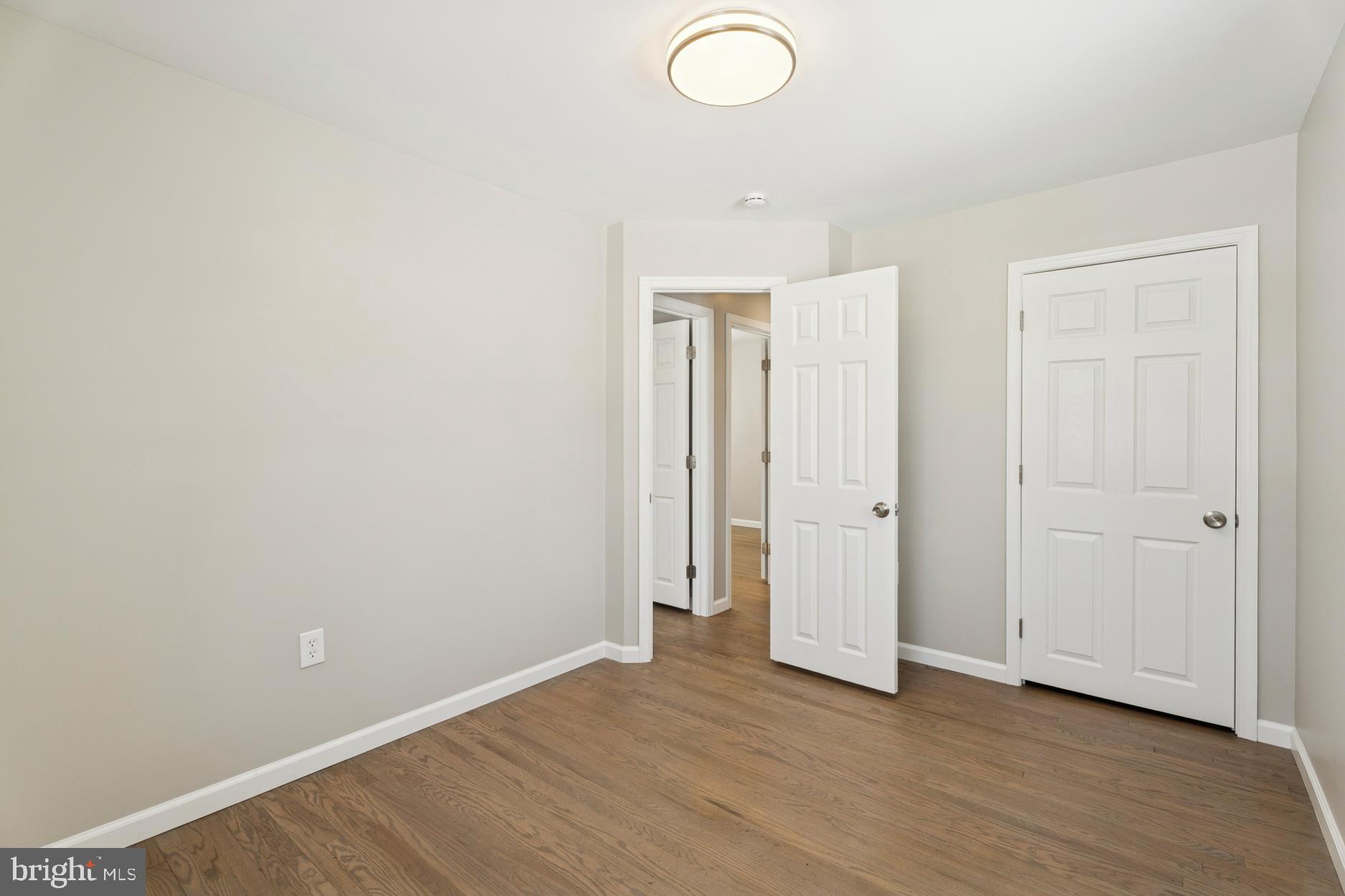 306 Grape Street Warminster, PA 18974 - Photo 19 of 25 a view of an empty room with wooden floor and closet
