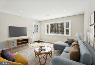 306 Grape Street Warminster, PA 18974 - Photo 2 of 25 a living room with furniture and a flat screen tv