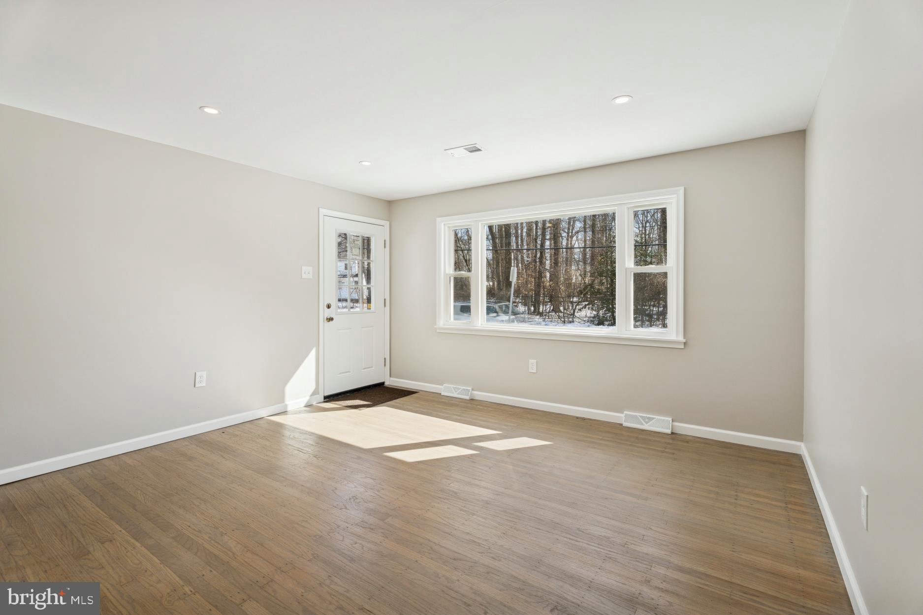 306 Grape Street Warminster, PA 18974 - Photo 3 of 25 an empty room with windows