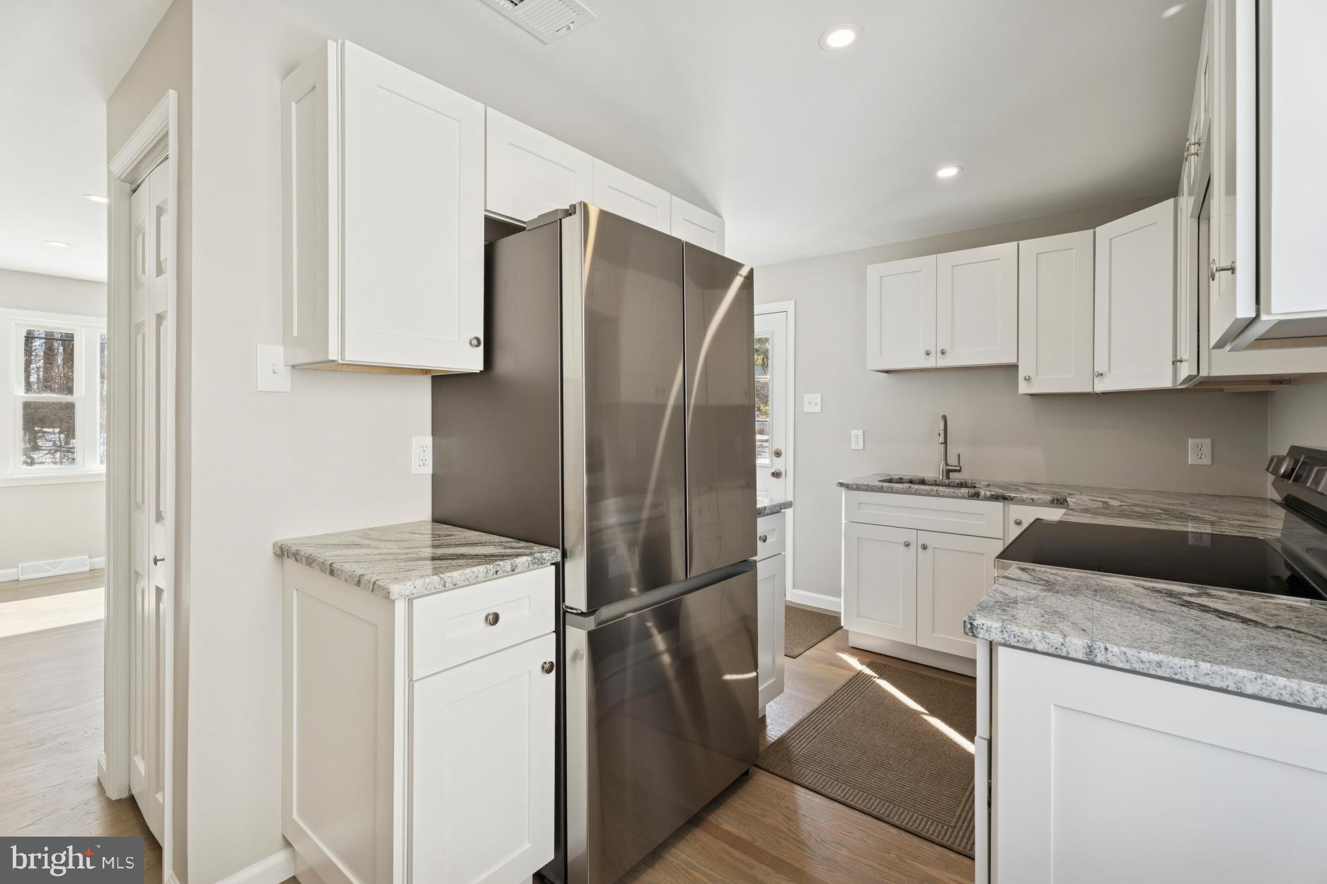 306 Grape Street Warminster, PA 18974 - Photo 9 of 25 a kitchen with a refrigerator sink and cabinets