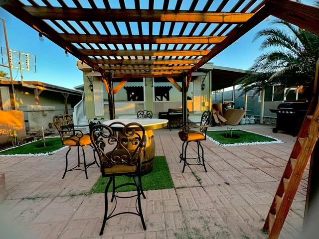 1395 Lause Road Bullhead City, AZ 86442 - Photo 28 of 34 Outdoor patio featuring a wooden pergola