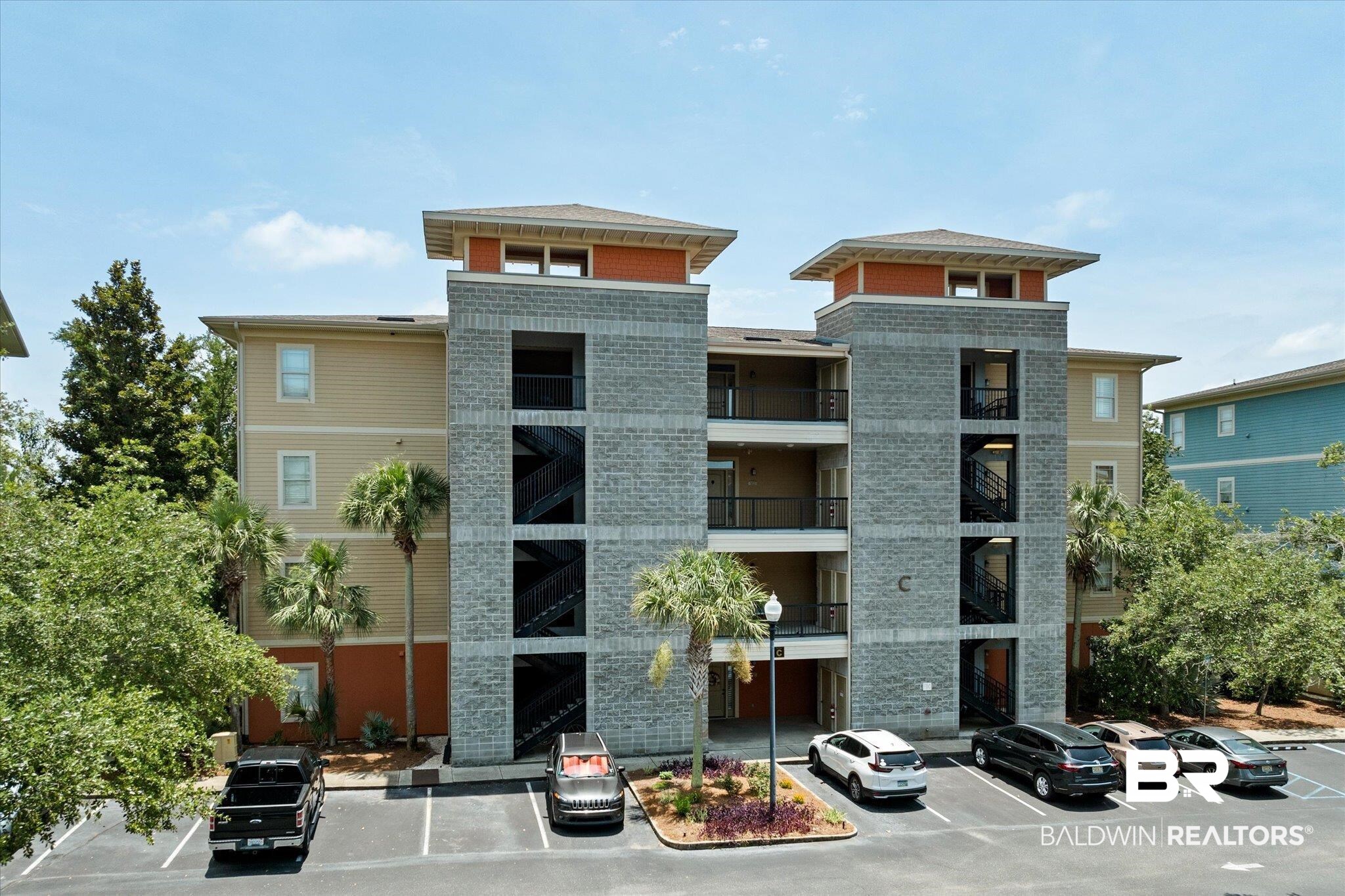 1430 Regency Road, Unit C103 Gulf Shores, AL 36542 - Photo 1 of 29 View of property with uncovered parking