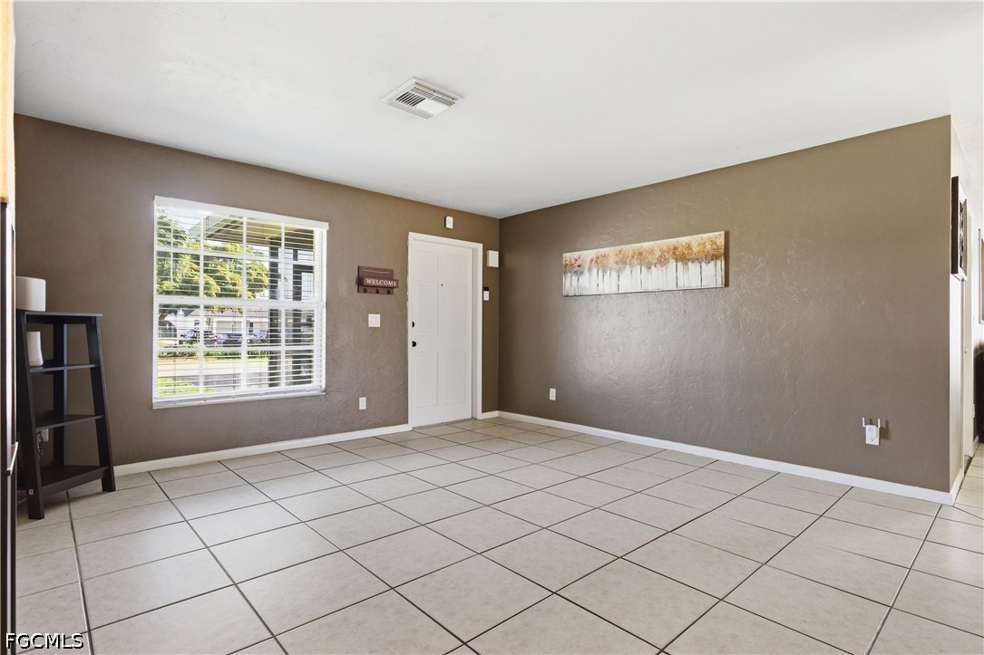 4960 20th Place Southwest Naples, FL 34116 - Photo 6 of 33 a view of an empty room with window