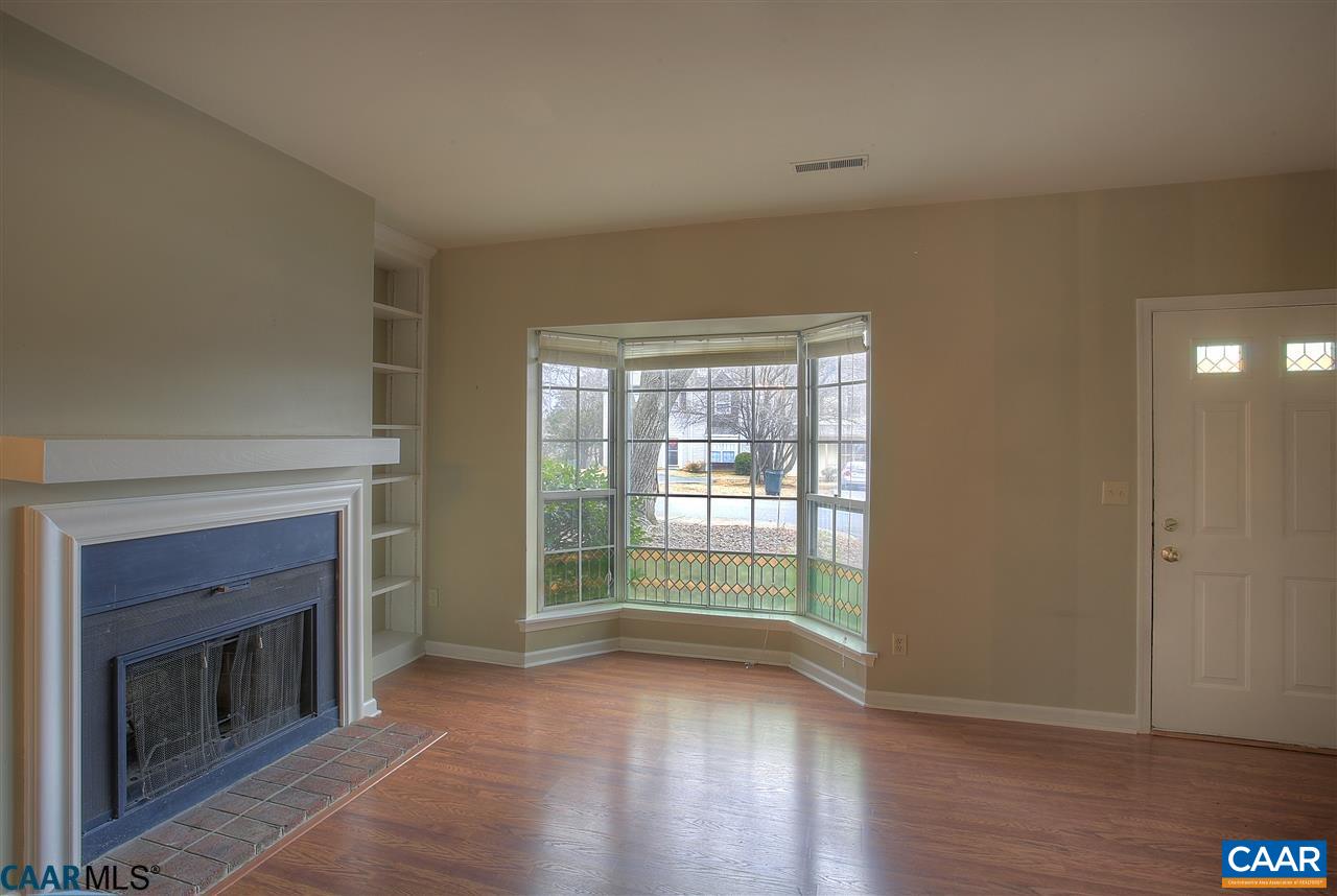 1619 Cool Spring Road Charlottesville, VA 22901 - Photo 3 of 14 a view of an empty room with wooden floor and a window