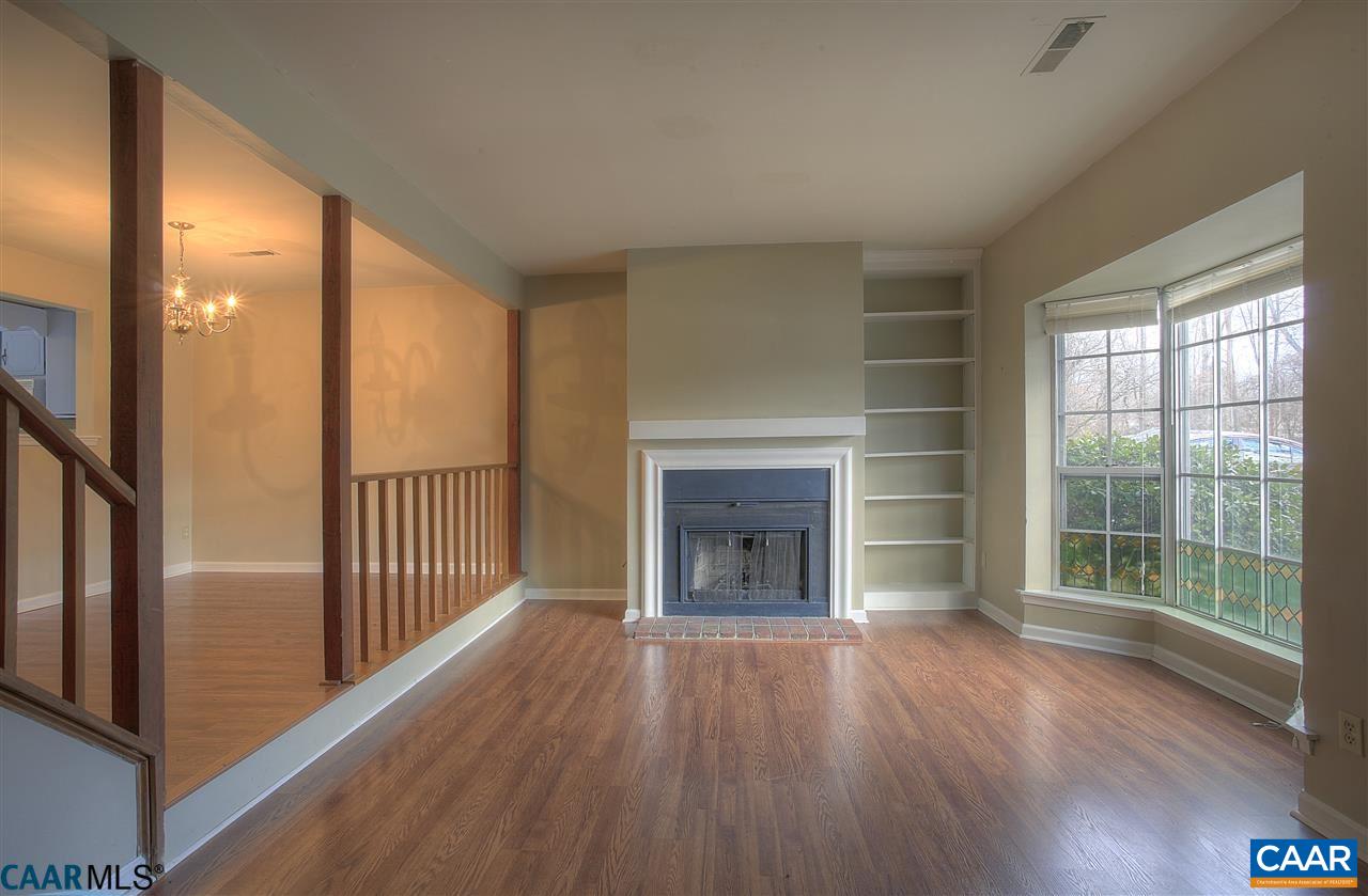 1619 Cool Spring Road Charlottesville, VA 22901 - Photo 4 of 14 a view of a hallway with wooden floor and a fireplace