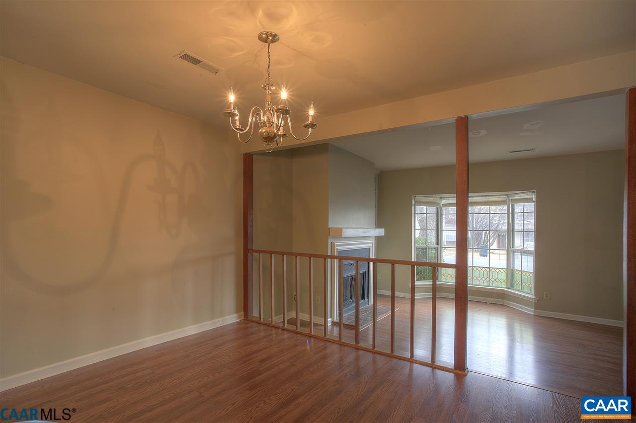 1619 Cool Spring Road Charlottesville, VA 22901 - Photo 6 of 14 a view of a room with wooden floor chandelier and windows