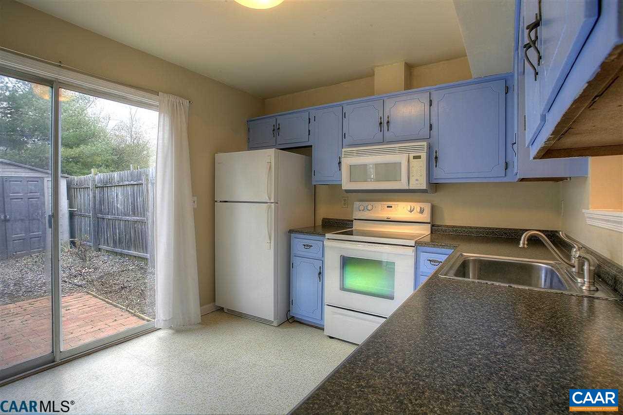 1619 Cool Spring Road Charlottesville, VA 22901 - Photo 7 of 14 a kitchen with a refrigerator a stove a sink and a window