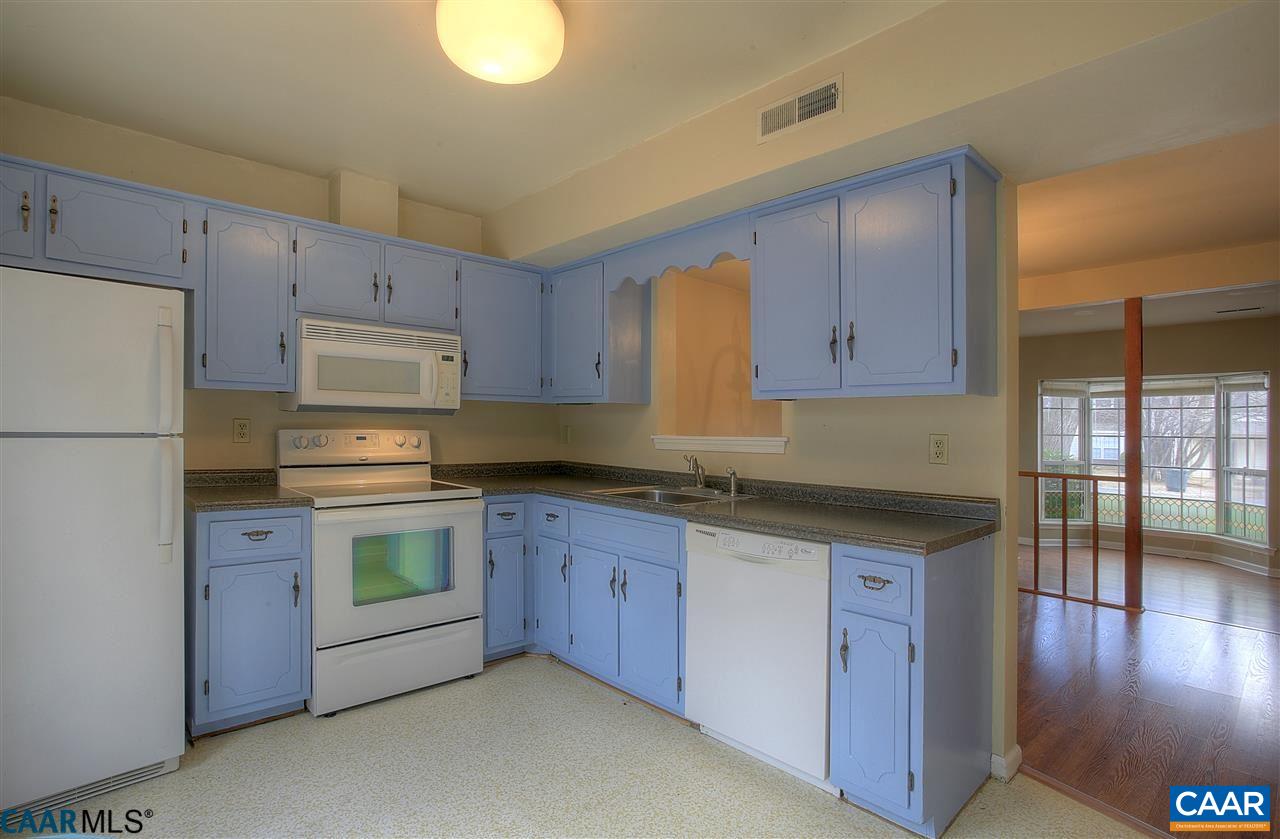 1619 Cool Spring Road Charlottesville, VA 22901 - Photo 8 of 14 a kitchen with stainless steel appliances granite countertop a stove a sink and a refrigerator