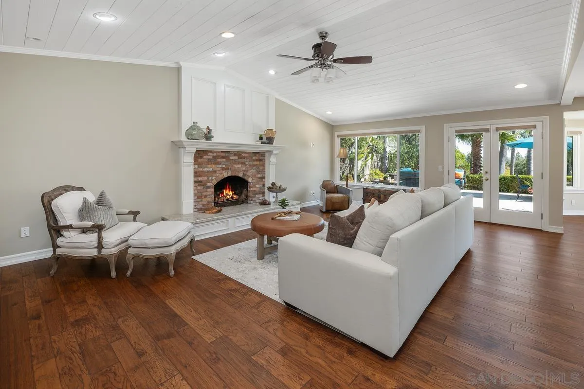 13627 Poway Springs Road Poway, CA 92064 - Photo 17 of 60 a living room with furniture and a fireplace