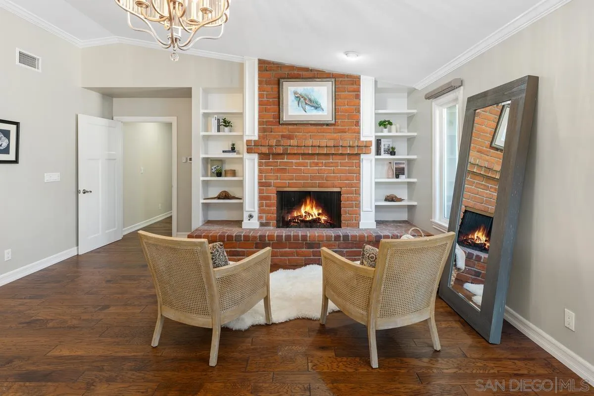 13627 Poway Springs Road Poway, CA 92064 - Photo 24 of 60 a living room with furniture a fireplace and a table