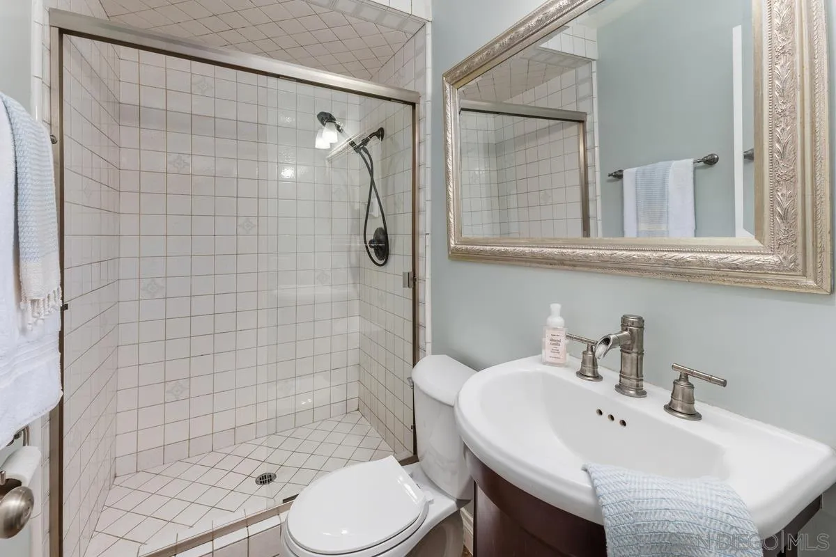 13627 Poway Springs Road Poway, CA 92064 - Photo 30 of 60 a bathroom with a sink toilet and shower