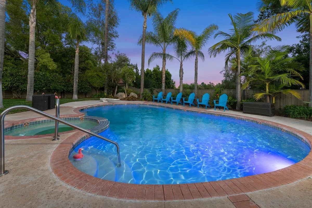 13627 Poway Springs Road Poway, CA 92064 - Photo 39 of 60 a view of a swimming pool with an outdoor space and seating area