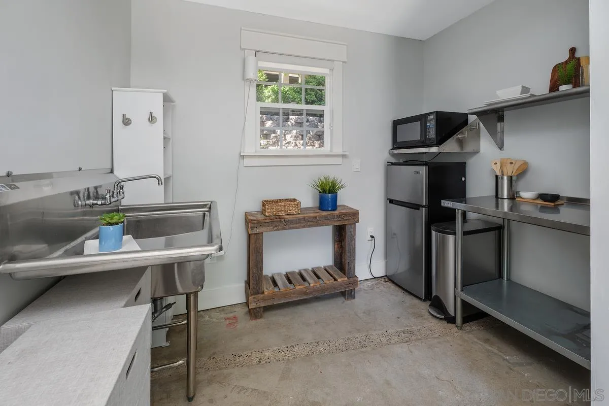 13627 Poway Springs Road Poway, CA 92064 - Photo 45 of 60 a dining room with furniture and a window
