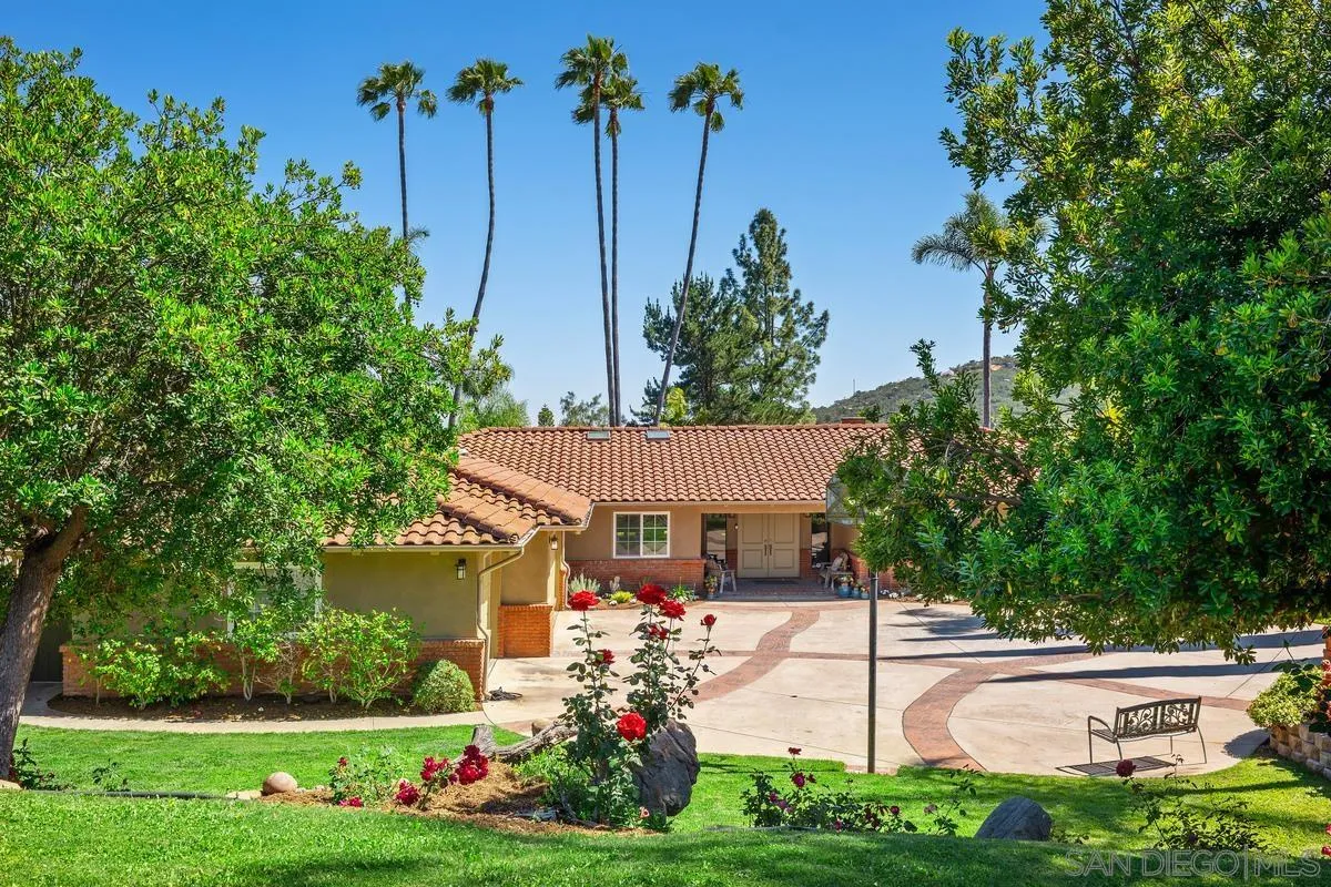 13627 Poway Springs Road Poway, CA 92064 - Photo 55 of 60 a view of a house with a yard and potted plants
