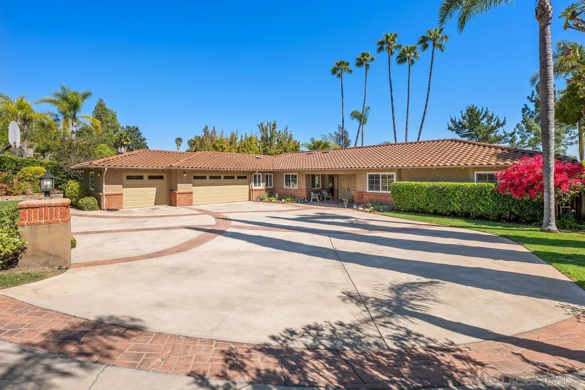 13627 Poway Springs Road Poway, CA 92064 - Photo 58 of 60 a front view of a house with a yard and potted plants