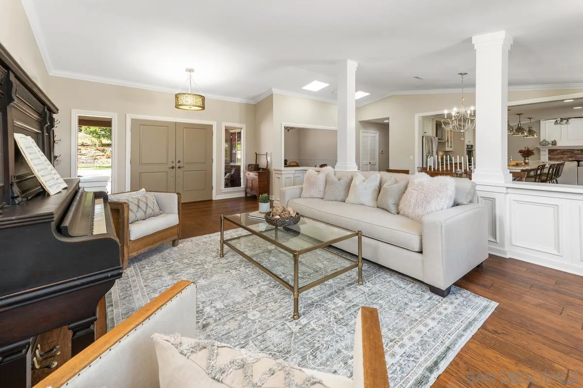 13627 Poway Springs Road Poway, CA 92064 - Photo 7 of 60 a living room with furniture hard wood floor and a flat screen tv
