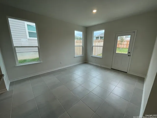 a view of a livingroom with furniture and an empty room