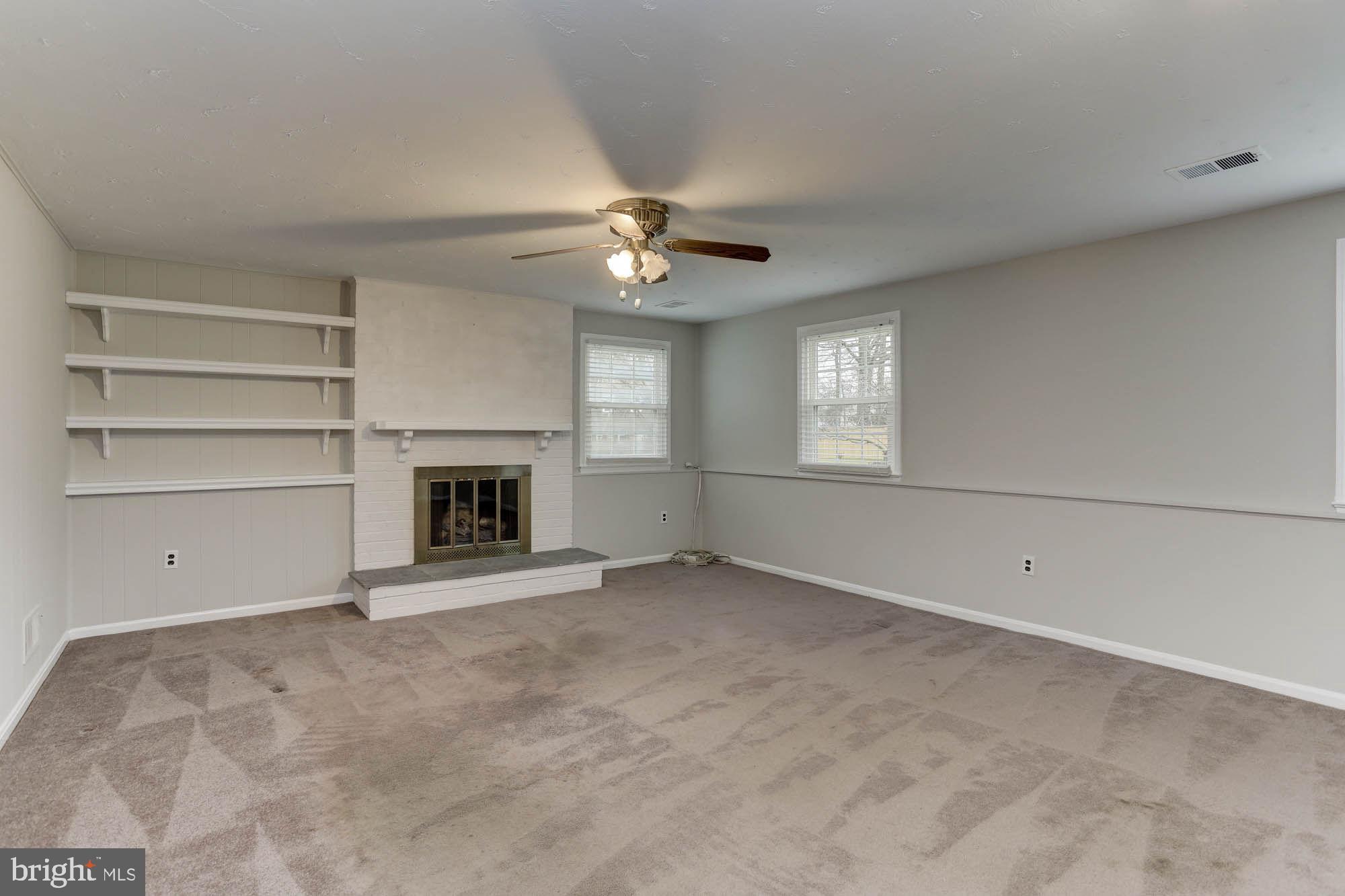 6104 Goodman Road Laurel, MD 20707 - Photo 33 of 42 Large finished family room with gas fireplace