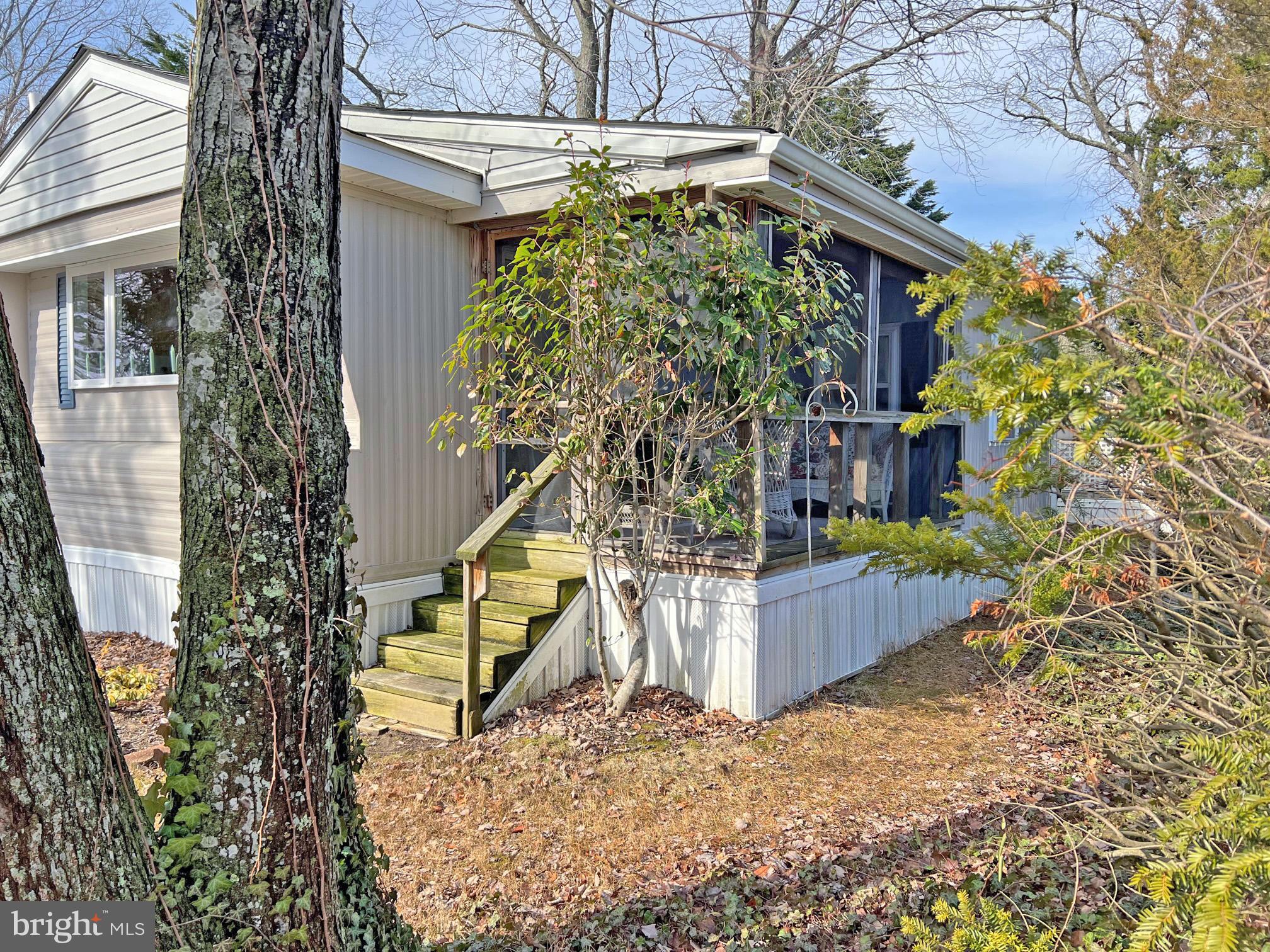33937 Cedar Road, Unit 86 Lewes, DE 19958 - Photo 21 of 22 Screened Porch Exterior