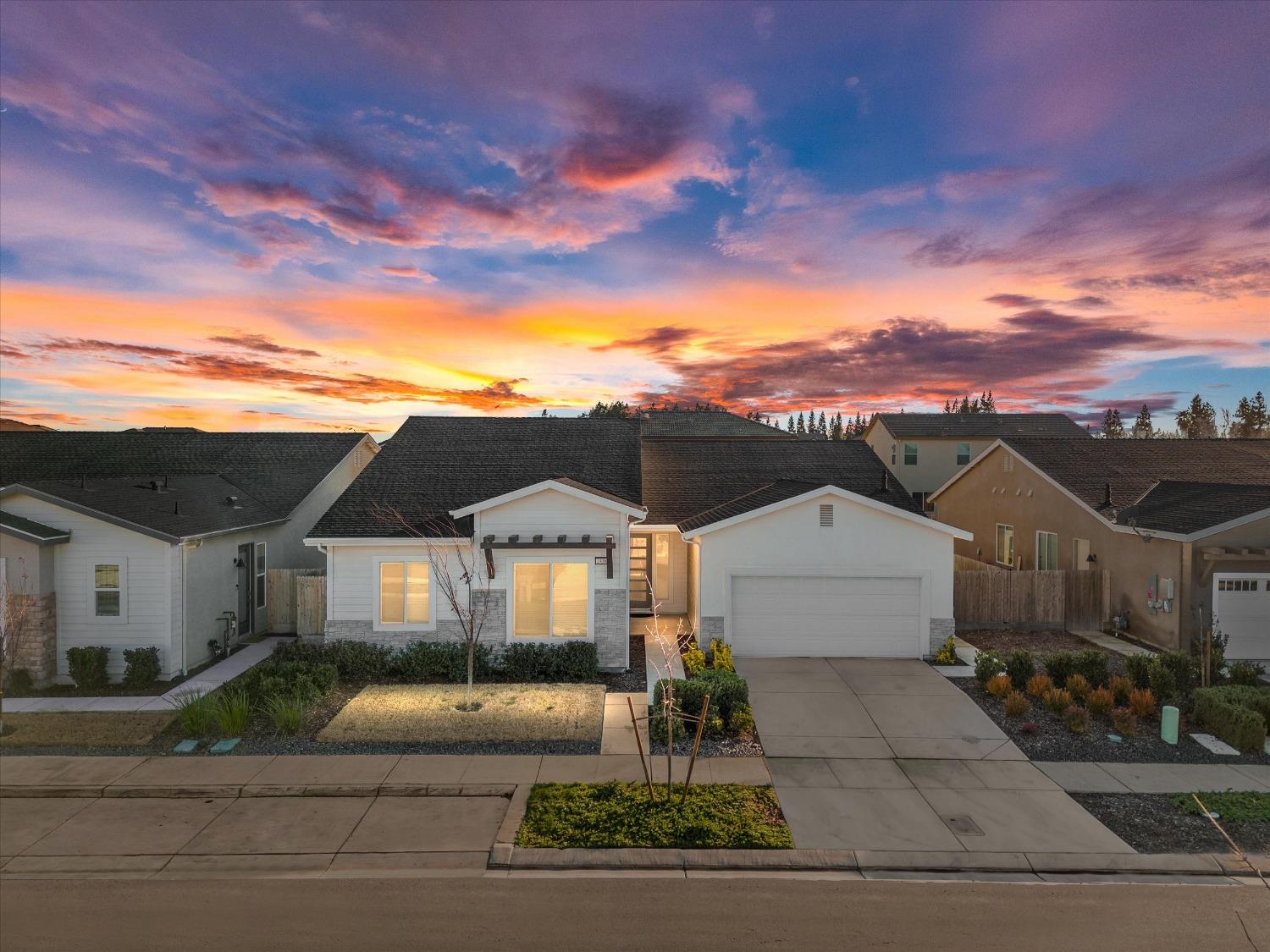 2438 Bastidas Drive Merced, CA 95340 - Photo 1 of 1 a front view of a house with a garden