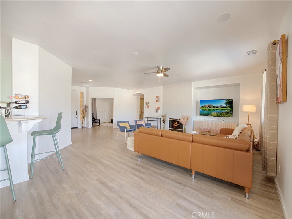 80718 Mountain Mesa Drive Indio, CA 92201 - Photo 16 of 47 a living room with furniture and a wooden floor