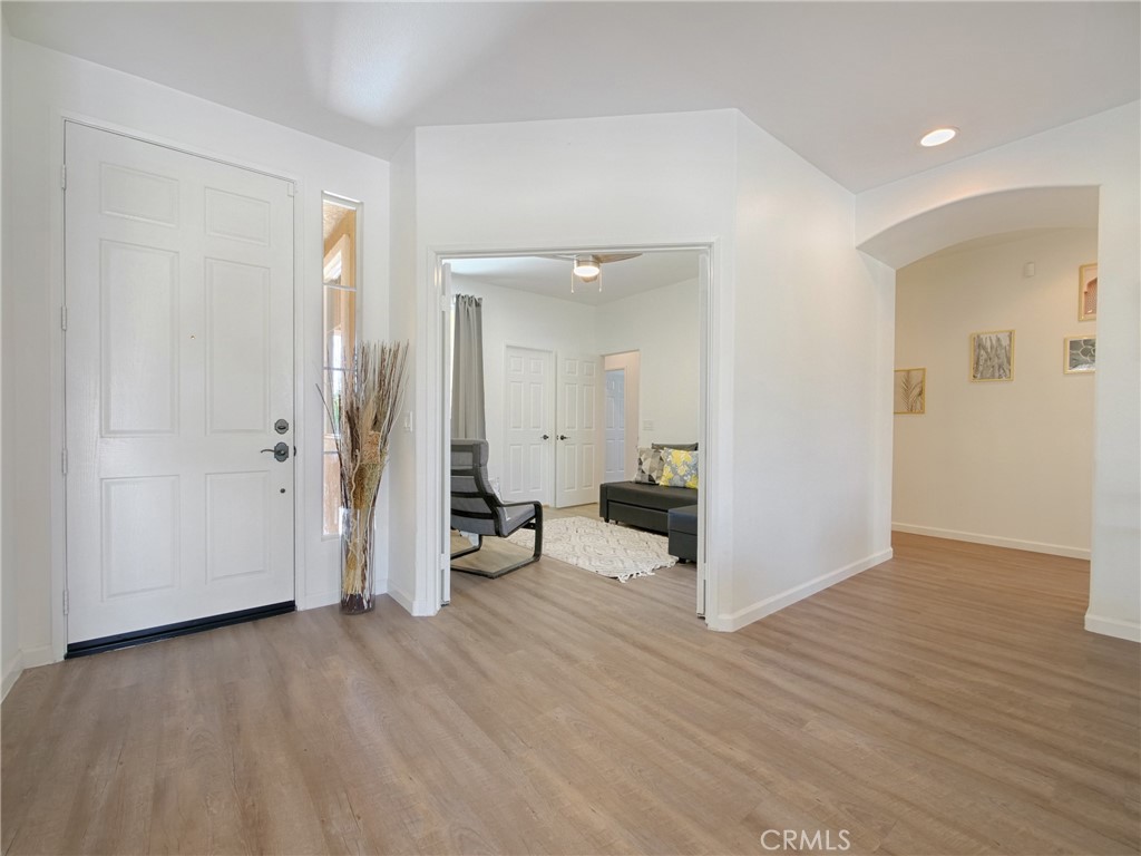 80718 Mountain Mesa Drive Indio, CA 92201 - Photo 17 of 47 a view of a livingroom with wooden floor and a bathroom