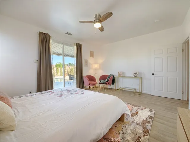 a bed room with a bed and a chandelier