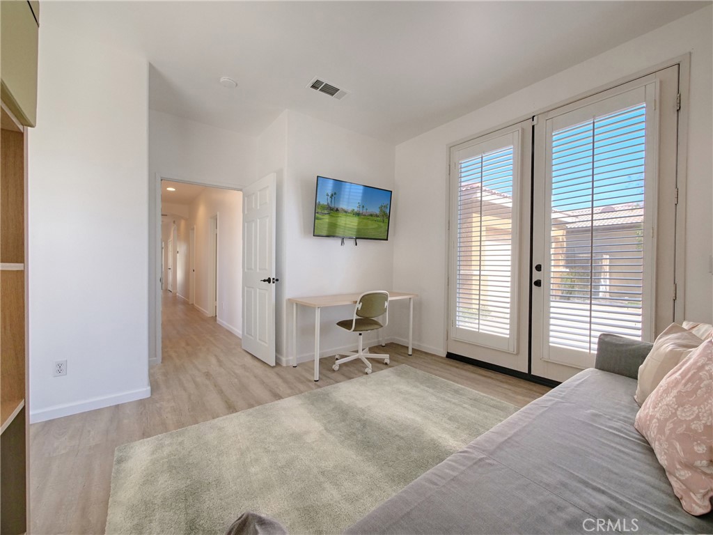 80718 Mountain Mesa Drive Indio, CA 92201 - Photo 28 of 47 a bedroom with a bed and a television