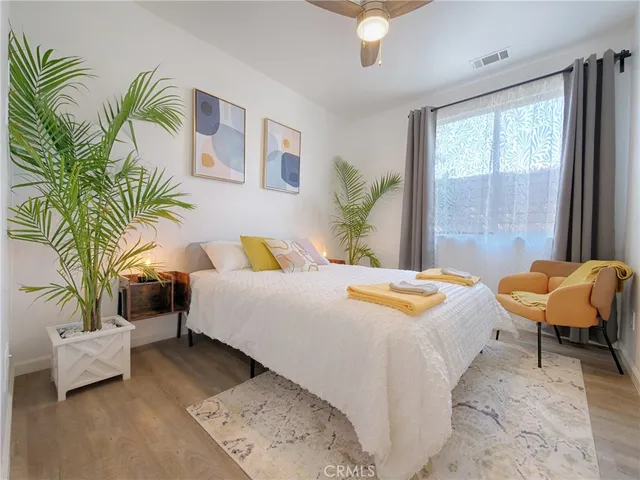 a bedroom with a bed and a couch