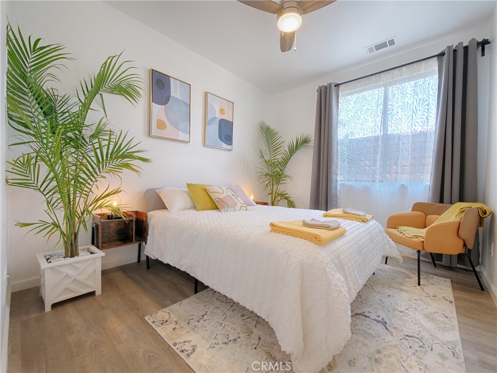 80718 Mountain Mesa Drive Indio, CA 92201 - Photo 32 of 47 a bedroom with a bed and a couch