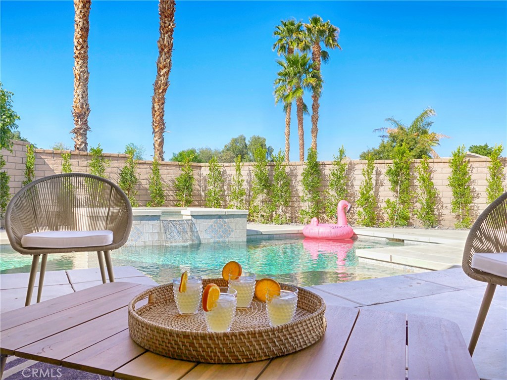 80718 Mountain Mesa Drive Indio, CA 92201 - Photo 41 of 47 a view of a swimming pool with a lounge chair
