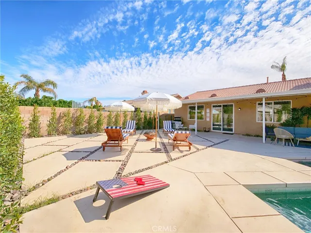 a view of swimming pool with outdoor seating